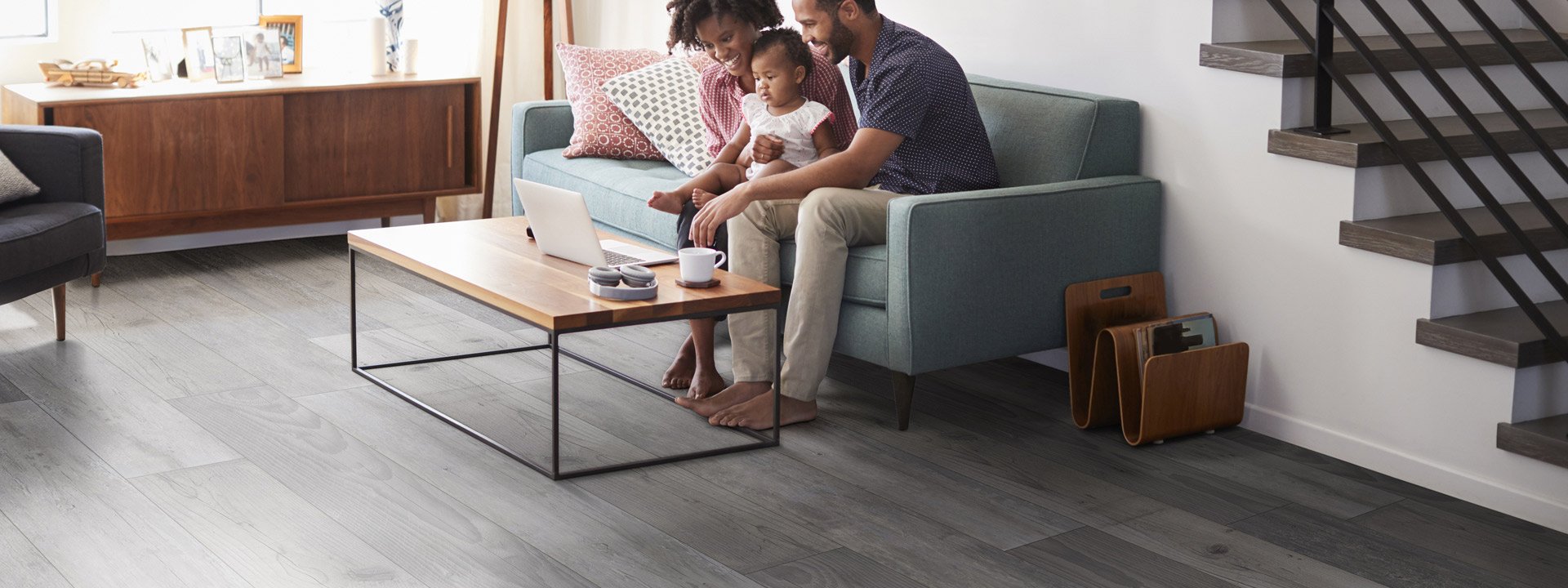 Beautiful gray LVT flooring set in a modern contemporary living space.